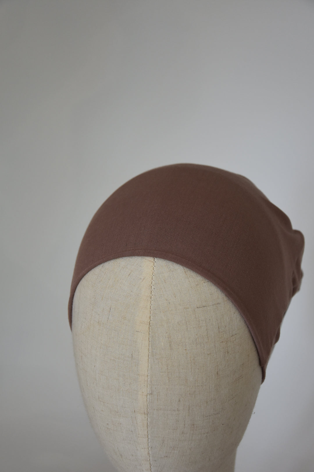 Bonnet wendbar taupe